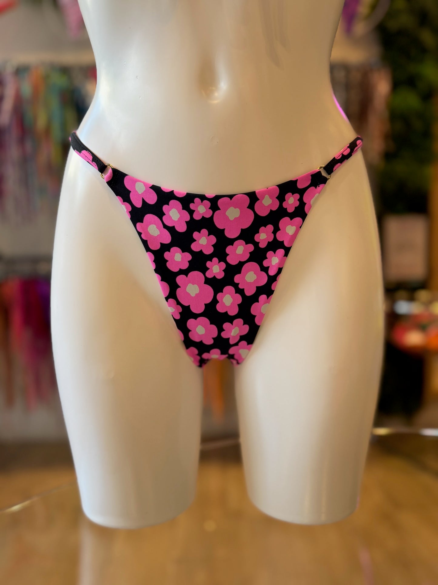 TANGA REGULABLE FLORES ROSA-NEGRO