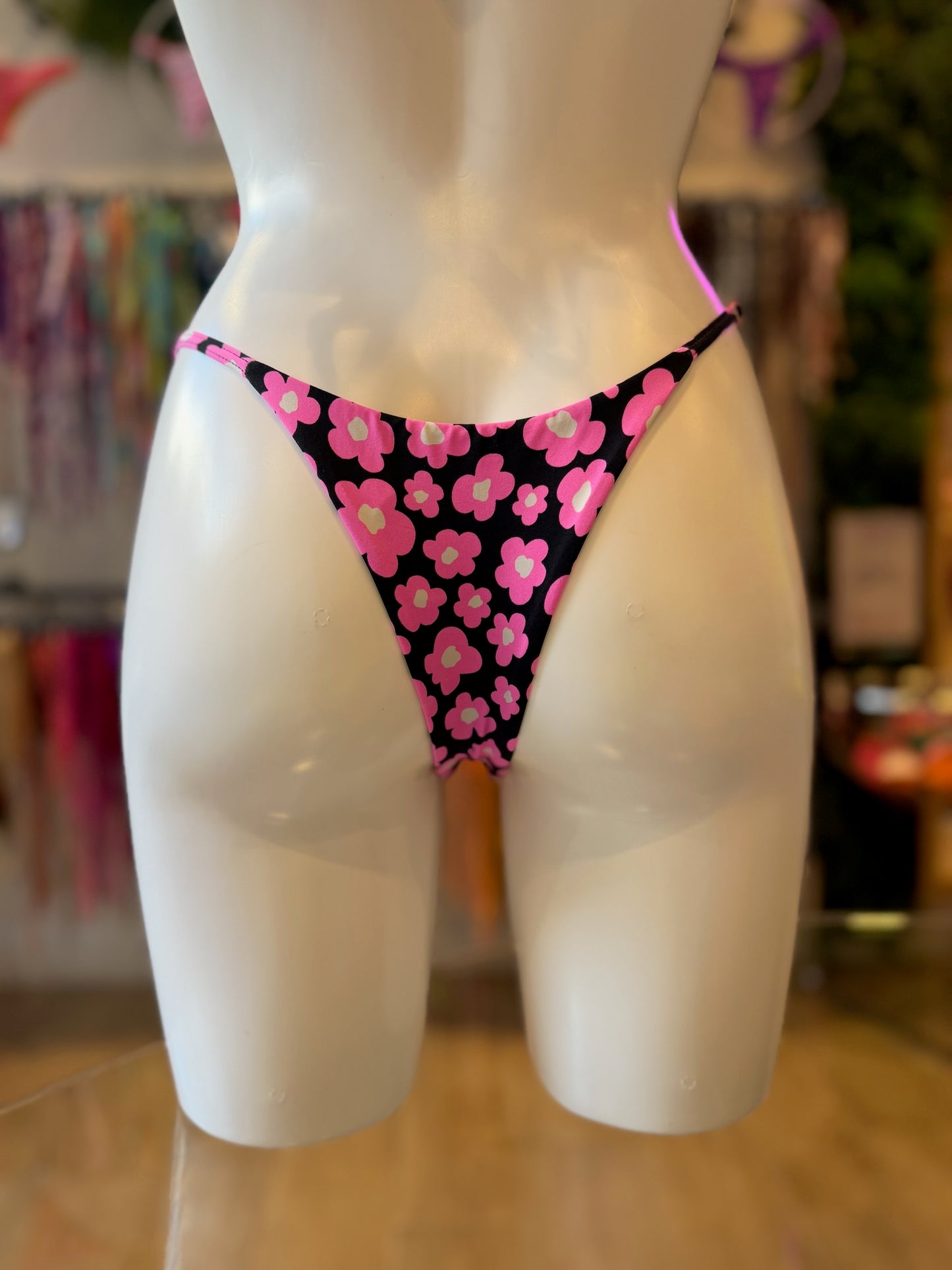 TANGA REGULABLE FLORES ROSA-NEGRO